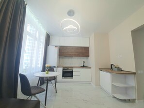 Fridge, oven, electric kettle, cookware/dishes/utensils