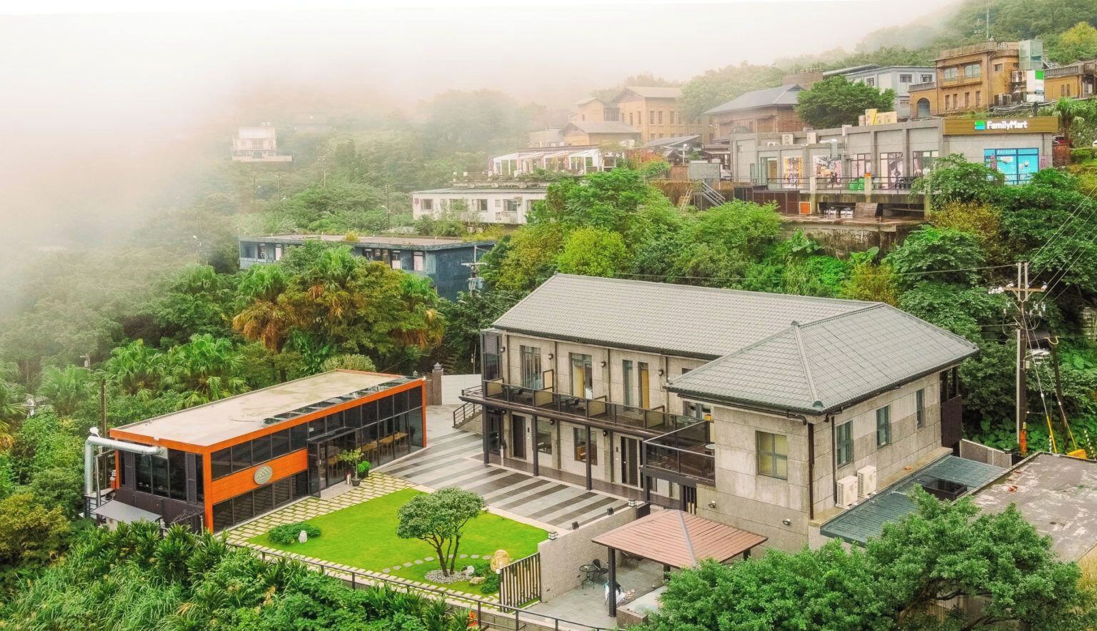 A residential area with modern houses, a FamilyMart store, and a well-maintained garden.