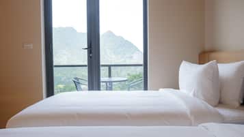 Family Triple Room, Non Smoking, Mountain View | Blackout curtains, free WiFi, bed sheets