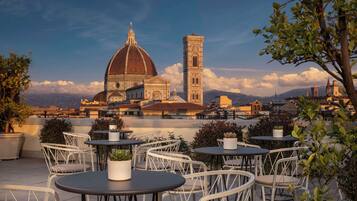 Enjoy al fresco dining with a panoramic view of the historic cityscape from our rooftop terrace.