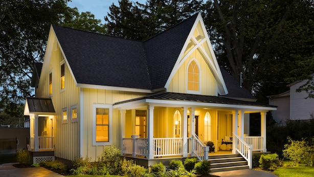 A two-story house with a porch, a staircase, and a well-maintained lawn. - Tuck'd Away - Newly Built Vacation Home Located in Downtown Saugatuck (Saugatuck)