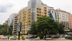 A multi-story building with a modern architectural design, featuring balconies and large windows. - Spacious, Comfortable & Purpose-Driven — An Ideal Sofia Stay (Sofia)