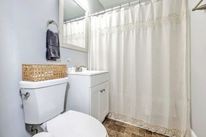 Bathtub, towels, soap, shampoo