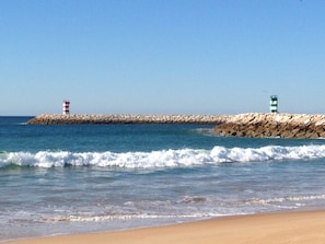On the beach, sun-loungers