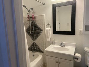 Combined shower/tub, hair dryer, towels, soap