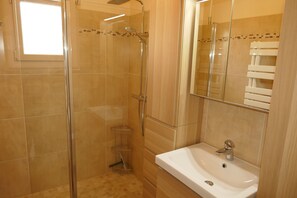 Shower, hair dryer, towels, toilet paper