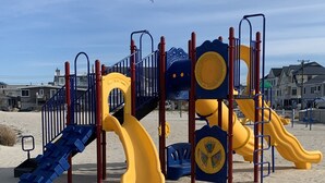 A playground with slides and climbing structures. - BEST BAYFRONT VALUE IN CHADWICK BEACH NEWLY RENOVATED SLEEPS 7 RATED 10/10 (Lavallette)