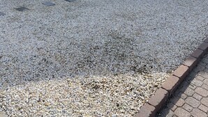 A house with a gravel driveway, a covered vehicle, and a tree. - BEST BAYFRONT VALUE IN CHADWICK BEACH NEWLY RENOVATED SLEEPS 7 RATED 10/10 (Lavallette)