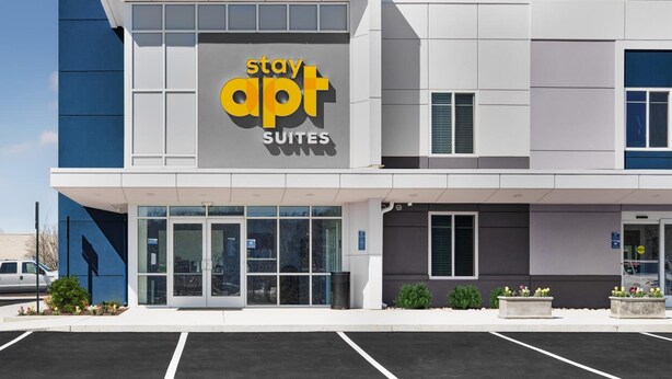 A modern building with a sign that reads "Stay Apt Suites." - StayAPT Suites Goldsboro-Seymour Johnson AFB (Goldsboro)