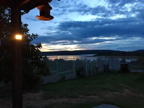 Enjoy a peaceful evening with a serene view of the water.