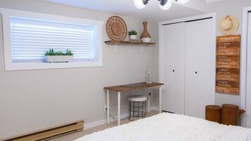 1 bedroom, desk, iron/ironing board, travel crib