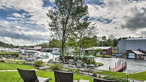 A riverside view with lounge chairs, a gazebo, and a dock. - Homey Laconia Home w/ Private Porch & Grill (Laconia)