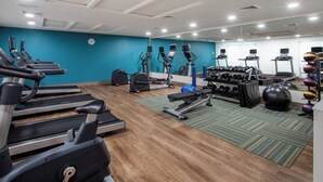 A gym with treadmills, elliptical machines, and free weights. - Holiday Inn Express & Suites Deland South by IHG (DeLand)