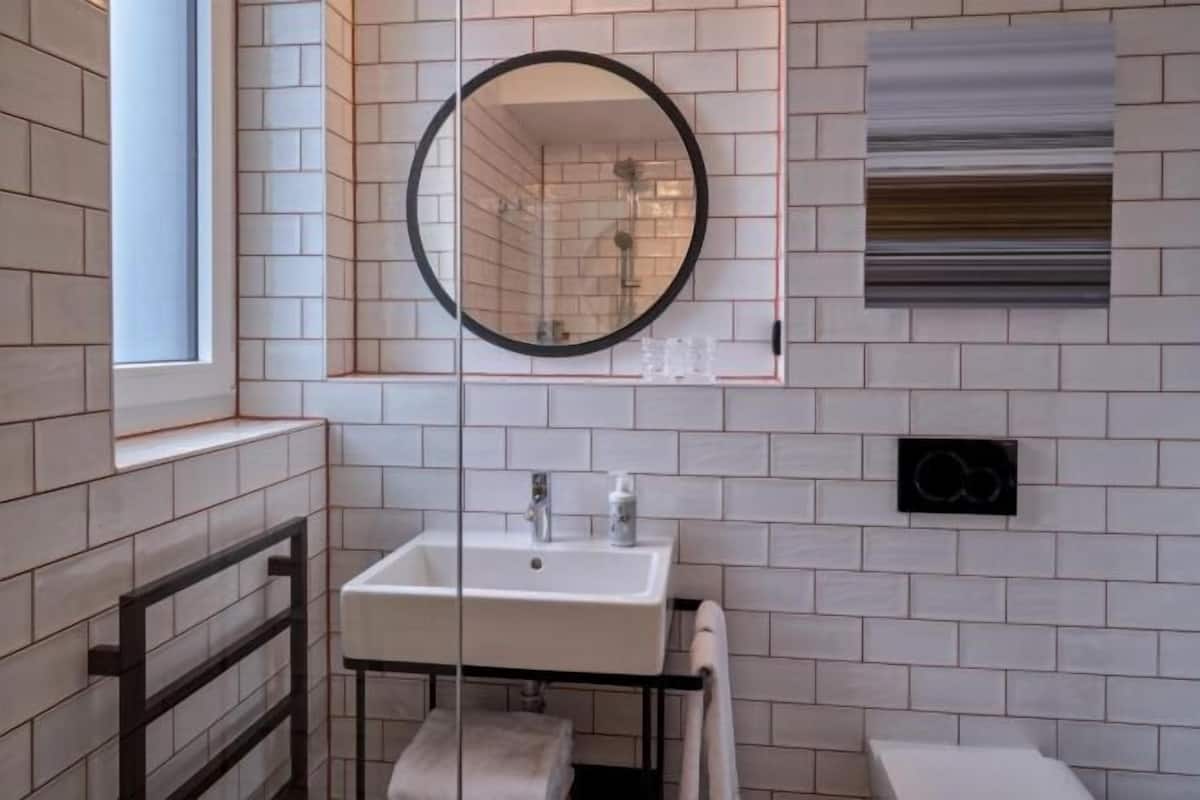 Shower, rainfall showerhead, hair dryer, towels