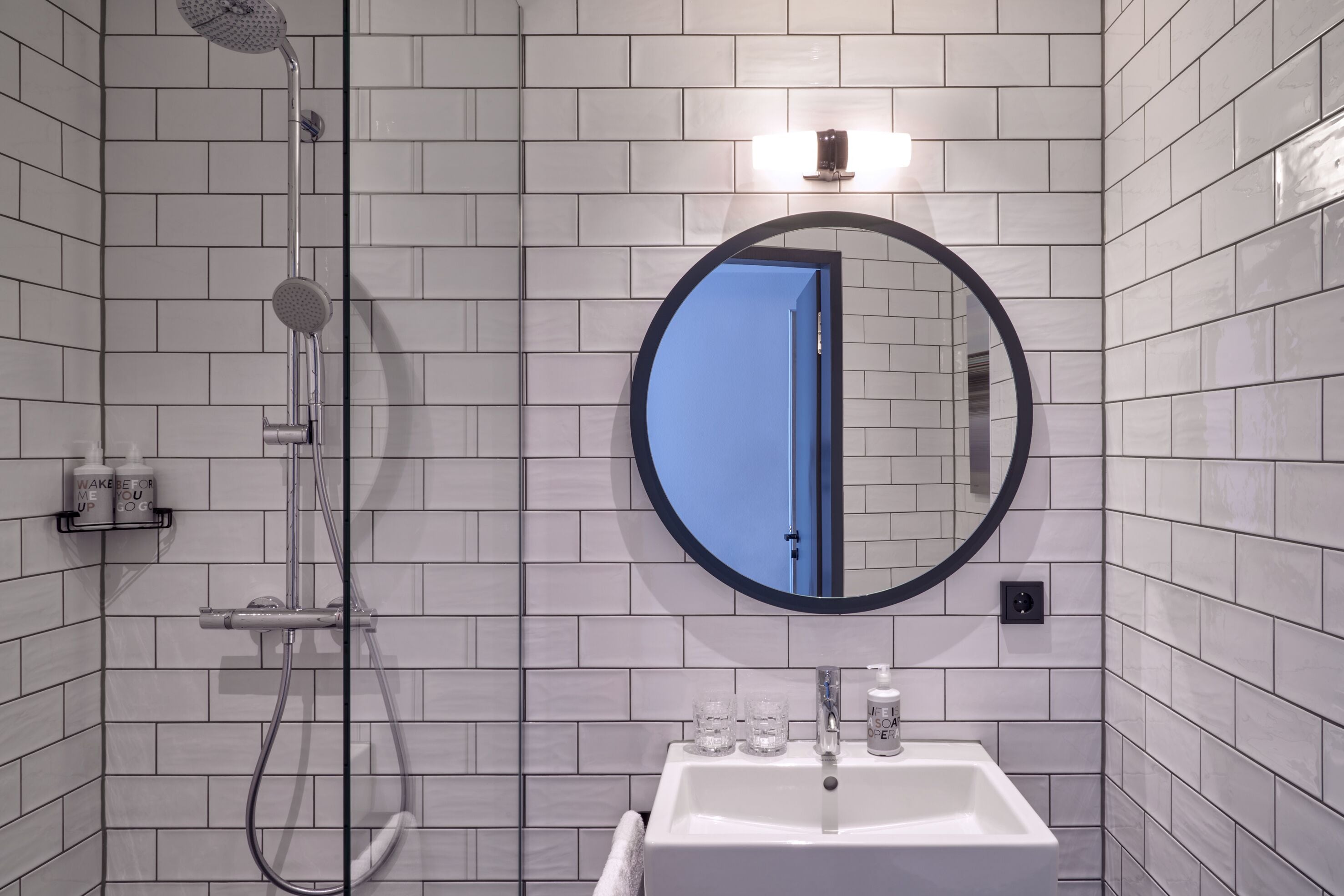 urban view | bathroom | shower, rainfall showerhead, hair dryer, towels