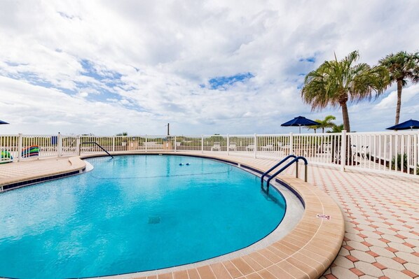 A heated pool, pool loungers