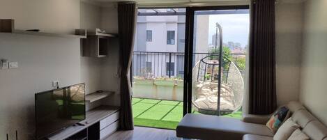 Luxury Penthouse | Living room | 49-inch LCD TV with premium TV channels, TV