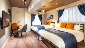 A modern hotel room with two beds, a dining area, and a TV. - Bird Land in Shinsaibashi east (Osaka)