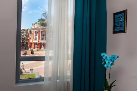 Desk, laptop workspace, blackout drapes, soundproofing