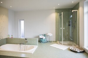 Bathtub, hair dryer, towels, soap