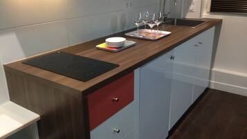 Fridge, microwave, stovetop, coffee/tea maker