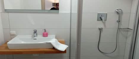 Shower, hair dryer, towels