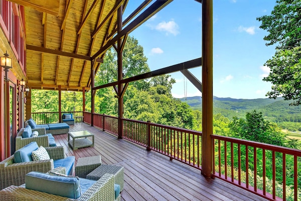 Enjoy morning coffee or an evening glass of wine on the fantastic covered deck overlooking majestic mountain views at Shadow Ridge Retreat!