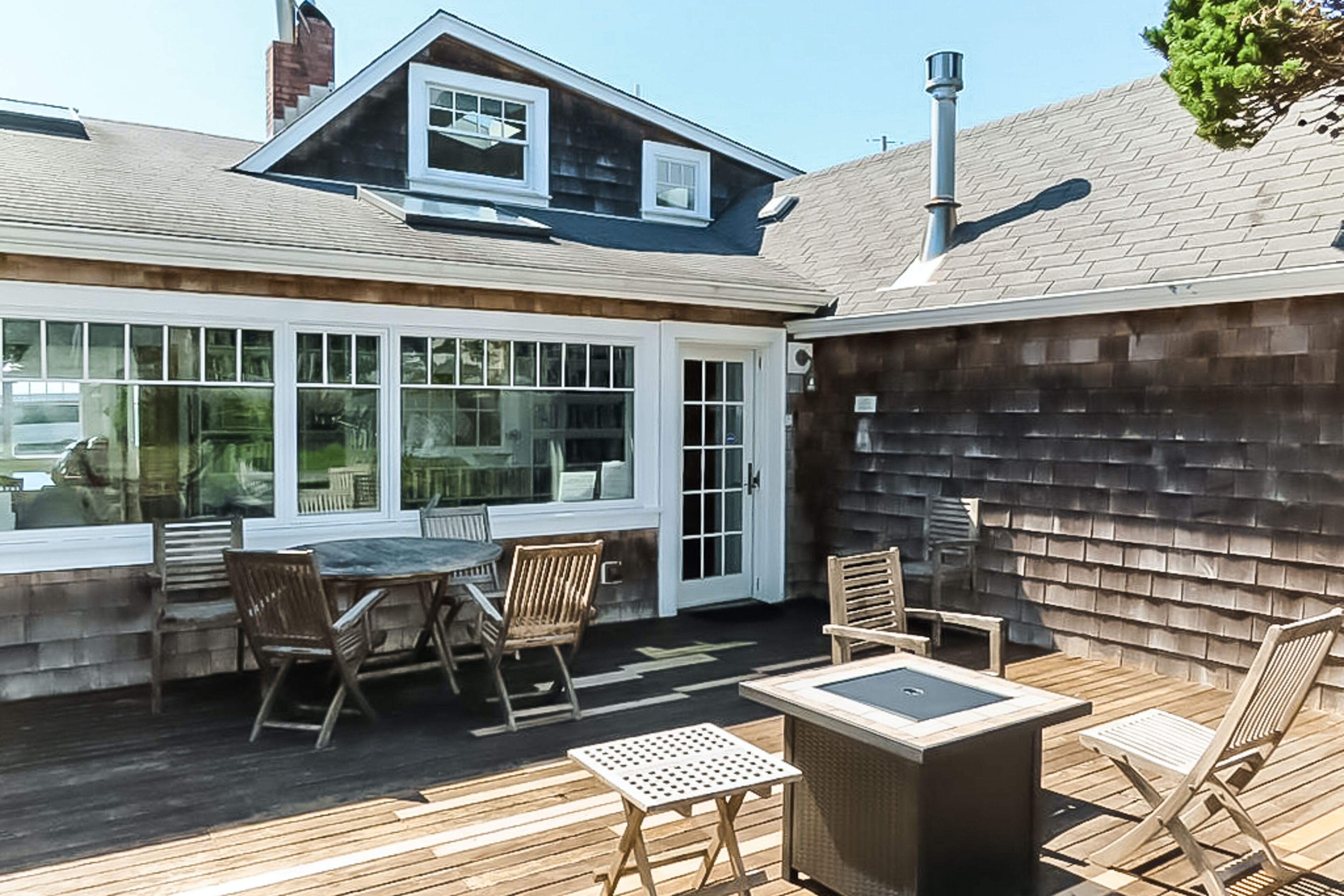 Ocean-view home with a private hot tub, easy beach access, & a large deck
