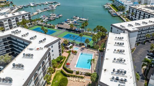 Waterfront 1BR condo in Marco Island with pool, WiFi, and marina access.