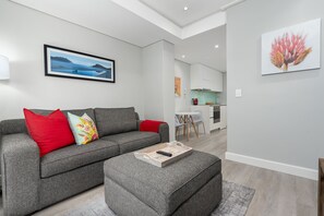 Signature Apartment | Living room | 32-inch flat-screen TV with cable channels, TV, Netflix - 35 on Main 303 (Cape Town)