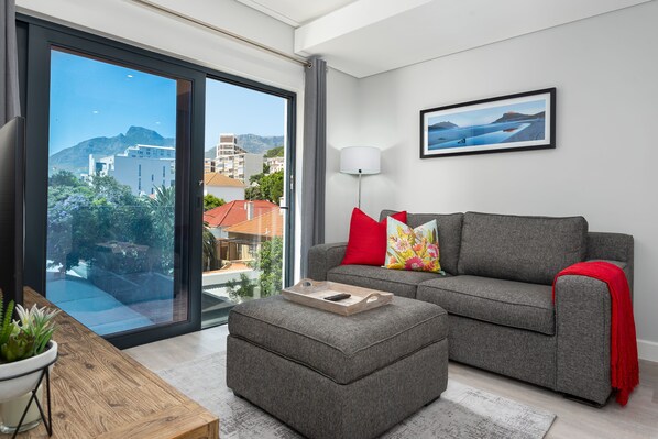 Signature Apartment | Living room | 32-inch flat-screen TV with cable channels, TV, Netflix - 35 on Main 303 (Cape Town)