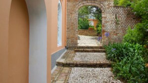 A brick pathway leading to a brick archway with a small garden area. - Private Pool & Breathtaking Views, Corfu Villa 1000 (Corfu)