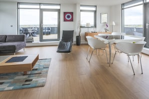 Three-Bedroom Penthouse (Flat 76) | Living area | Flat-screen TV - Heron House (Bedford)