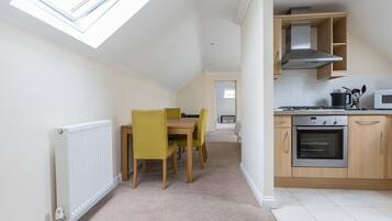 Luxury Apartment | Private kitchen | Full-sized fridge, microwave, oven, stovetop