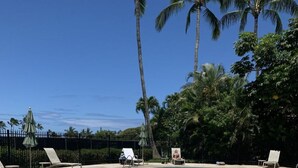 A clear blue pool with a lifeguard chair and lounge chairs around the perimeter. - An Affordable Alternative to Expensive Accommodations in Poipu (Poipu)
