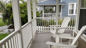 A covered porch with white railings and two Adirondack chairs. - Beautiful, family friendly Bradley Beach home 1.5 blocks from the beach! (Bradley Beach)