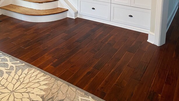 A staircase with wooden steps and white railings, leading to a white storage unit with a television. - Beautiful, family friendly Bradley Beach home 1.5 blocks from the beach! (Bradley Beach)