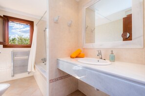 Bathtub, hair dryer, towels