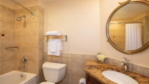A bathroom with a bathtub, toilet, sink, and a mirror. -   $899/OBO, 2 Br/2Ba for 8, Balc, Kit (Orlando)