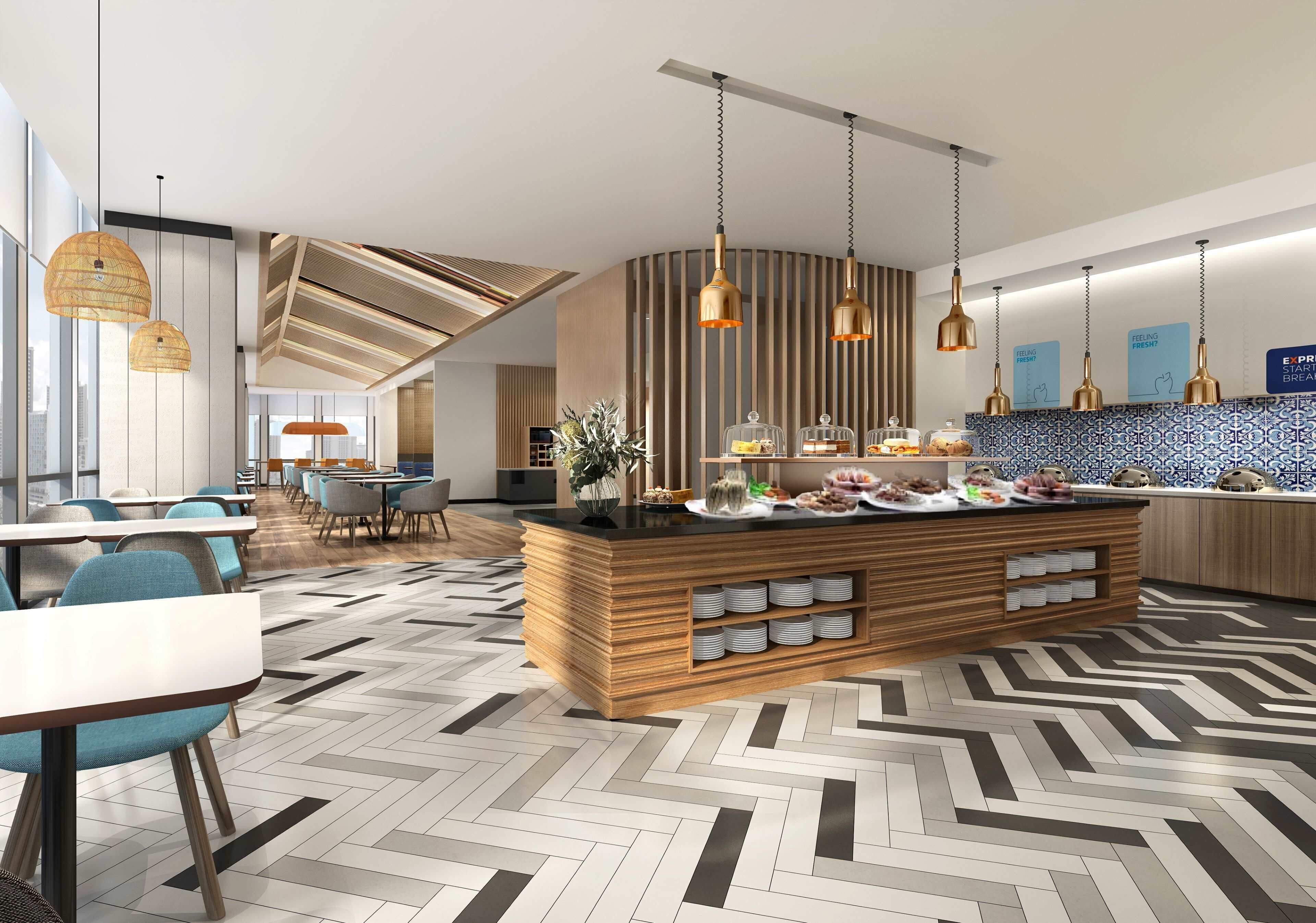 A modern hotel lobby with a central island counter, seating area, and a view of the cityscape.