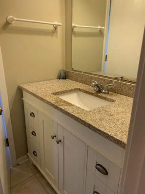 Combined shower/tub, hair dryer, towels - Oceanfront Escape at Eastern Sails (North Topsail Beach)