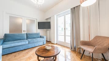 Apartment, 2 Bedrooms | Living room | Flat-screen TV