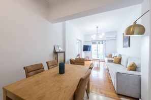 Apartment, 4 Bedrooms | Living area | Flat-screen TV