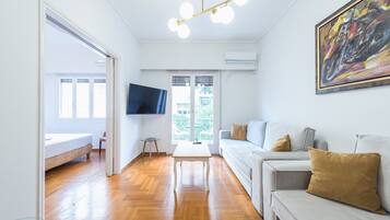 Apartment, 4 Bedrooms | Living area | Flat-screen TV