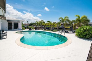 A heated pool, pool loungers - Waterfront 2BR/2.5BA Marco Island home with pool and waterfront views (Marco Island)