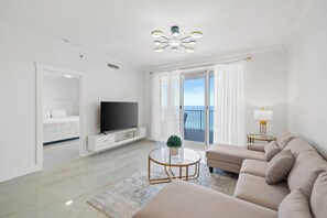 Condo, 2 Bedrooms, Balcony, Ocean View (1702) | Living area | 32-inch flat-screen TV with cable channels, TV - Twin Palms by Book That Condo (Panama City Beach)