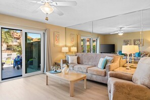 Condo, 2 Bedrooms, Pool Access (219) | Living area | 32-inch flat-screen TV with cable channels, TV - Gulf Highlands by Book That Condo (Panama City Beach)