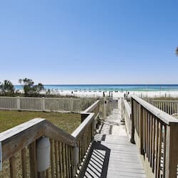 On the beach, white sand, sun-loungers, beach umbrellas
