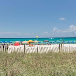 On the beach, white sand, sun loungers, beach umbrellas