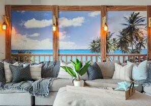 Condo, 3 Bedrooms, Balcony, Ocean View (1806-3) | Living area | 32-inch flat-screen TV with cable channels, TV - Calypso Resort and Towers by Book That Condo (Panama City Beach)